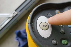 Electrical testing device with test button: Electrical safety tests by Peregrine Electrical in Bristol